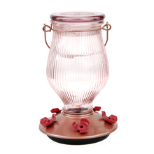 Load image into Gallery viewer, A Perky-Pet Rose Gold Top-Fill Glass Hummingbird Feeder with a clear glass body and rose gold accents, including a base plate with red flower-shaped ports.