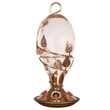 Load image into Gallery viewer, A tinted glass hummingbird feeder with a copper base and four copper flower feeding ports.